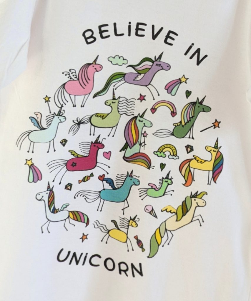 Kids white t-shirt with colorful “Believe in Unicorn” design printed by PrinteeClub – custom t-shirt printing in Montreal